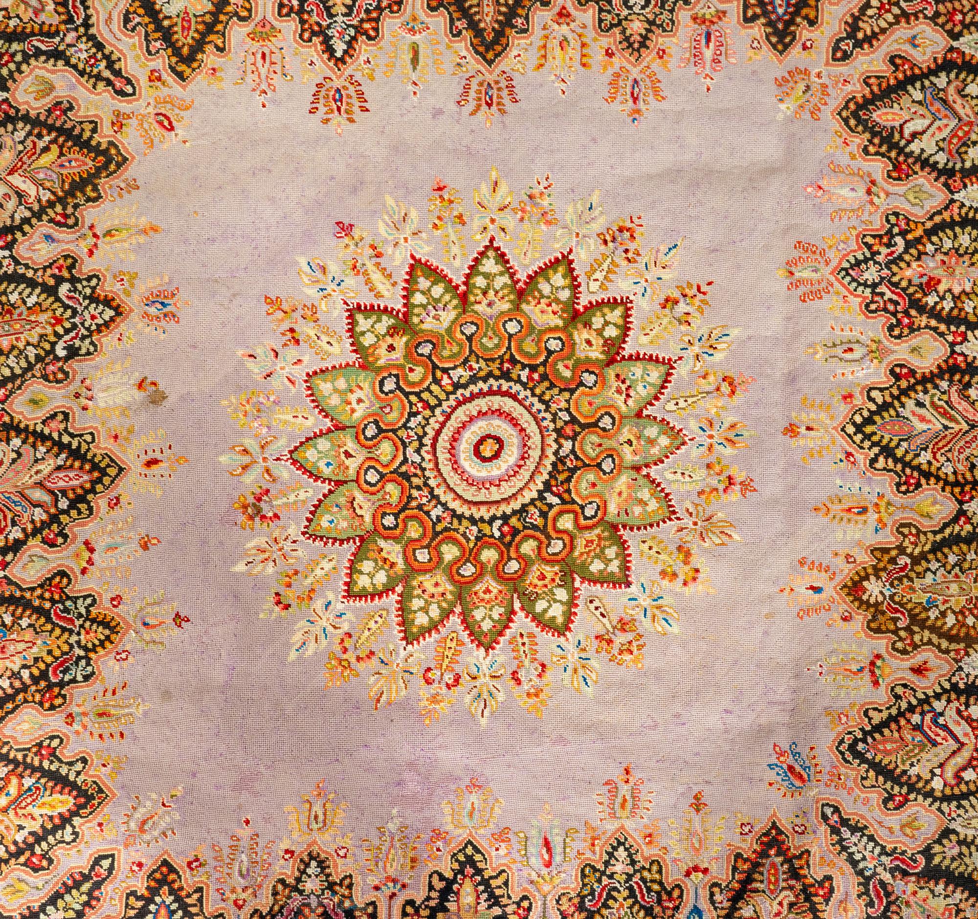 A Persian Paisley Needlework Rug