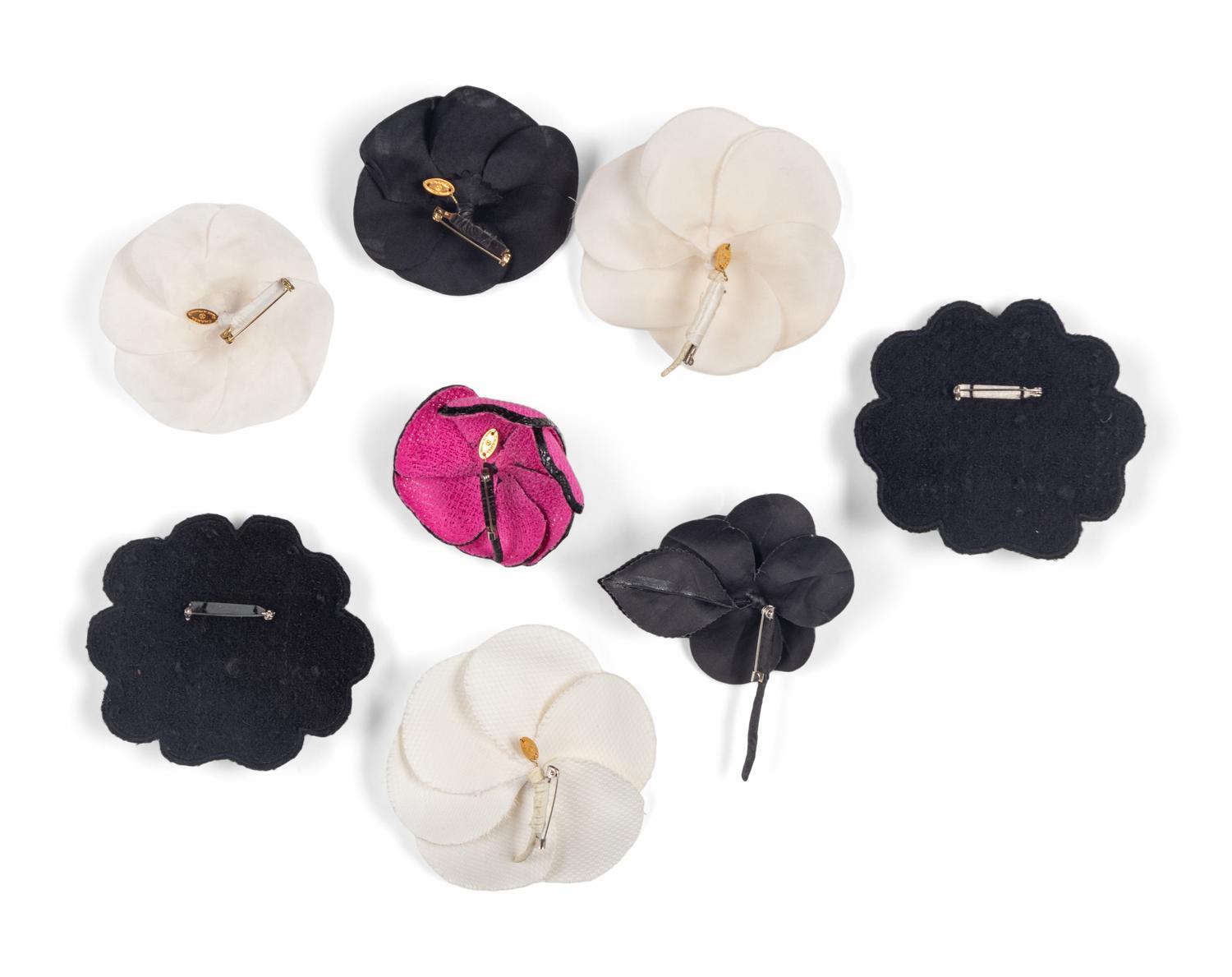 Eight Chanel Camellia Brooches