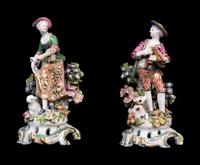 A Pair of Chelsea Porcelain Figures of a Boy and Girl — RED ANCHOR PERIOD, 1752-1756