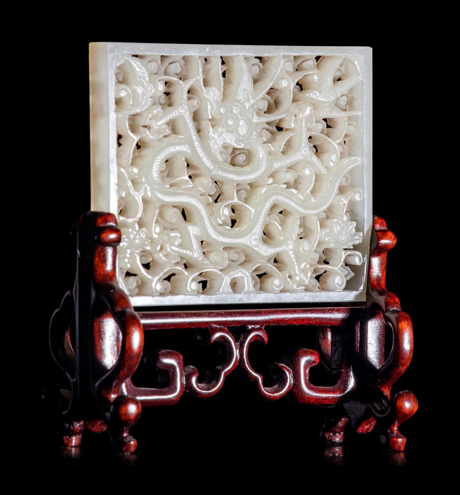 A Reticulated White Jade 'Dragon' Plaque