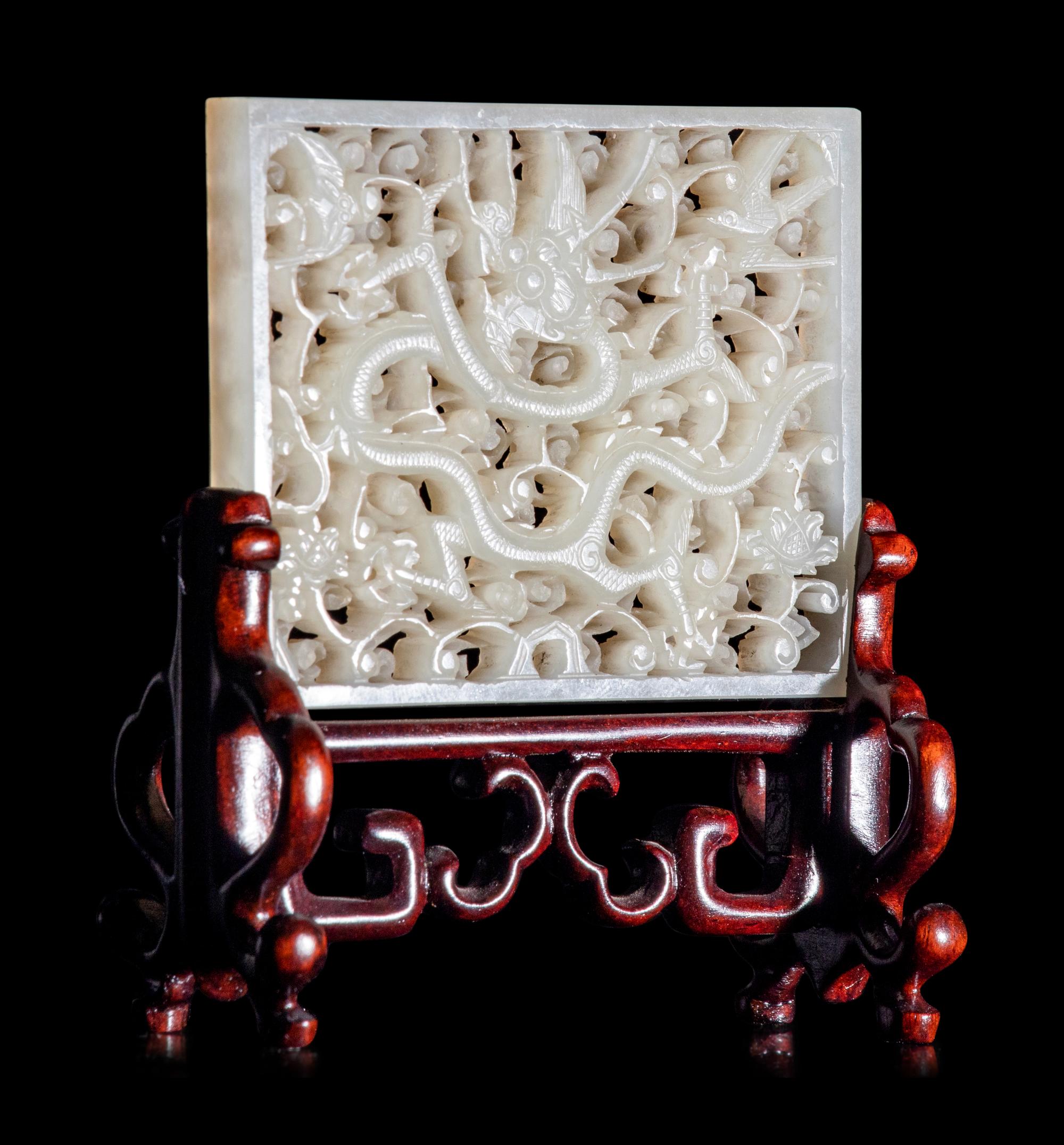 A Reticulated White Jade 'Dragon' Plaque
