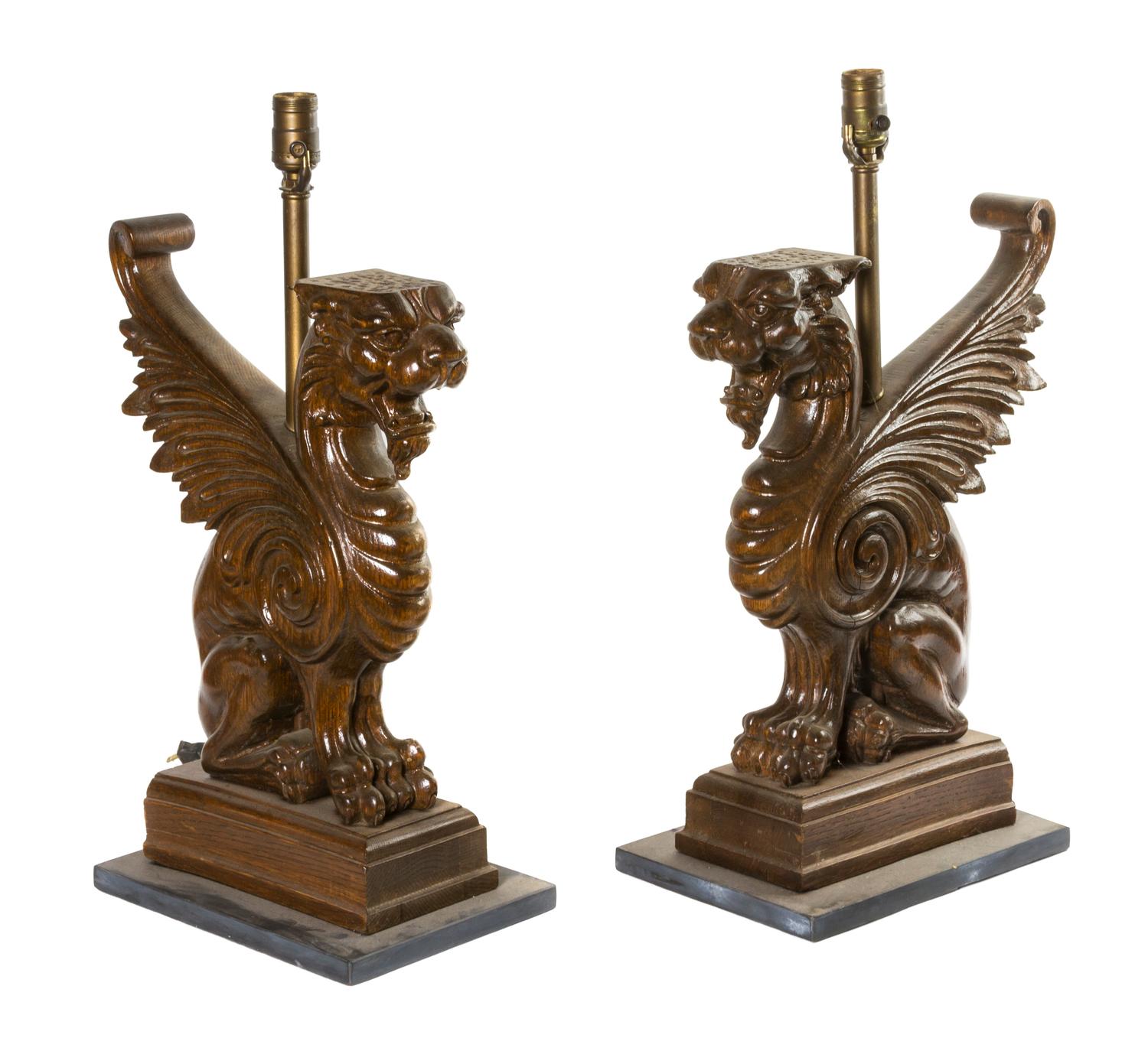 A Pair of Carved Wood Griffins, Height 19 3/4 inches.