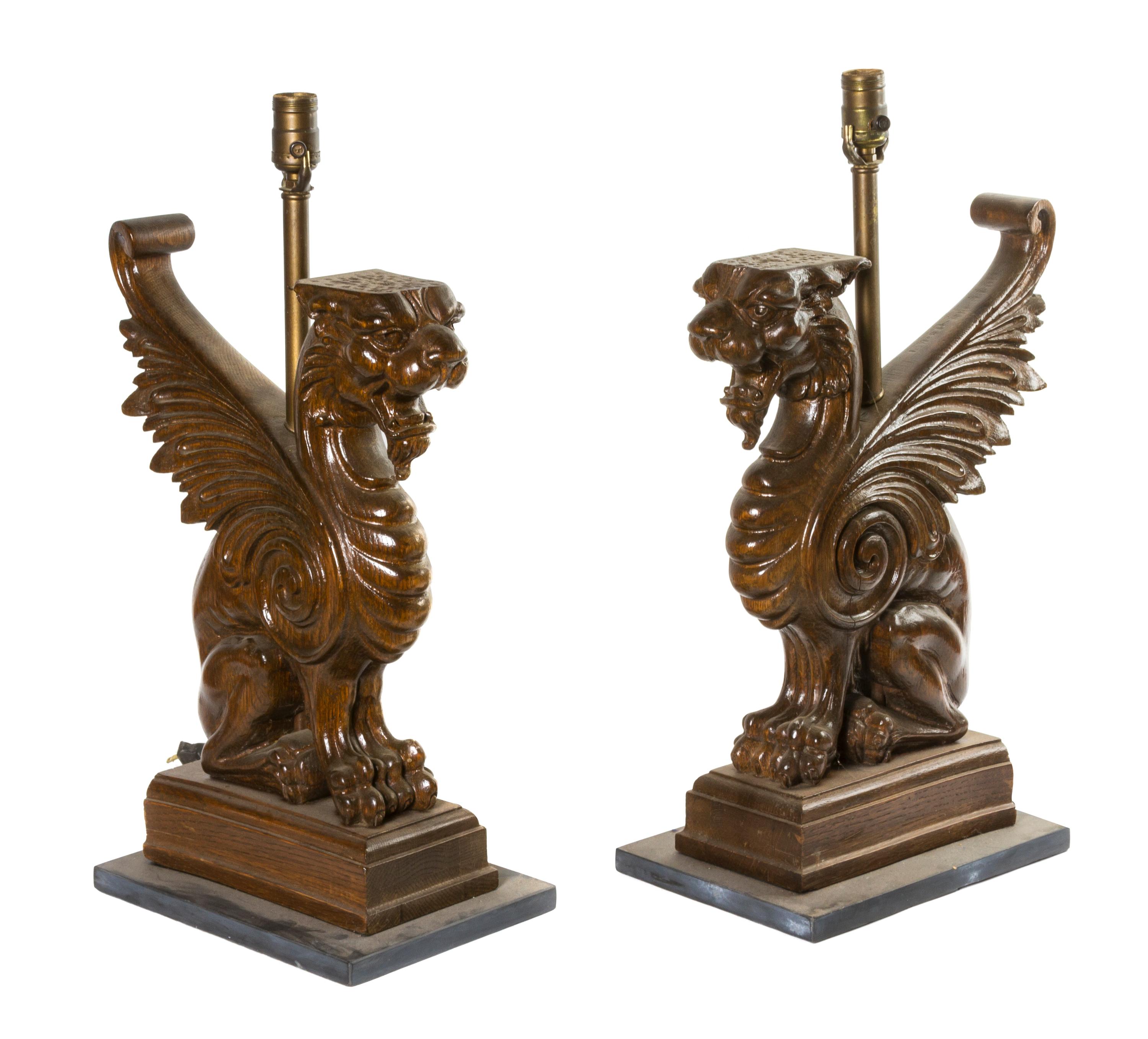 A Pair of Carved Wood Griffins, Height 19 3/4 inches.