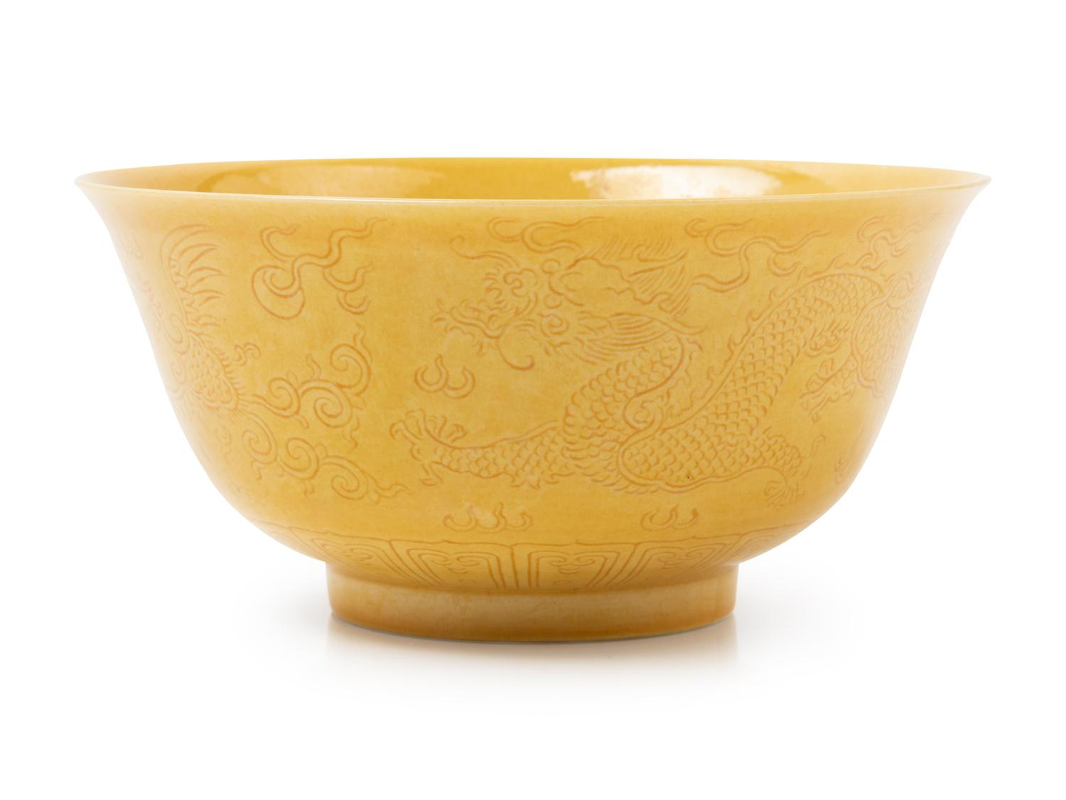 An Incised Yellow Glazed Porcelain 'Dragon and Phoenix' Bowl