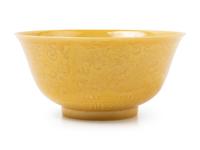 An Incised Yellow Glazed Porcelain 'Dragon and Phoenix' Bowl