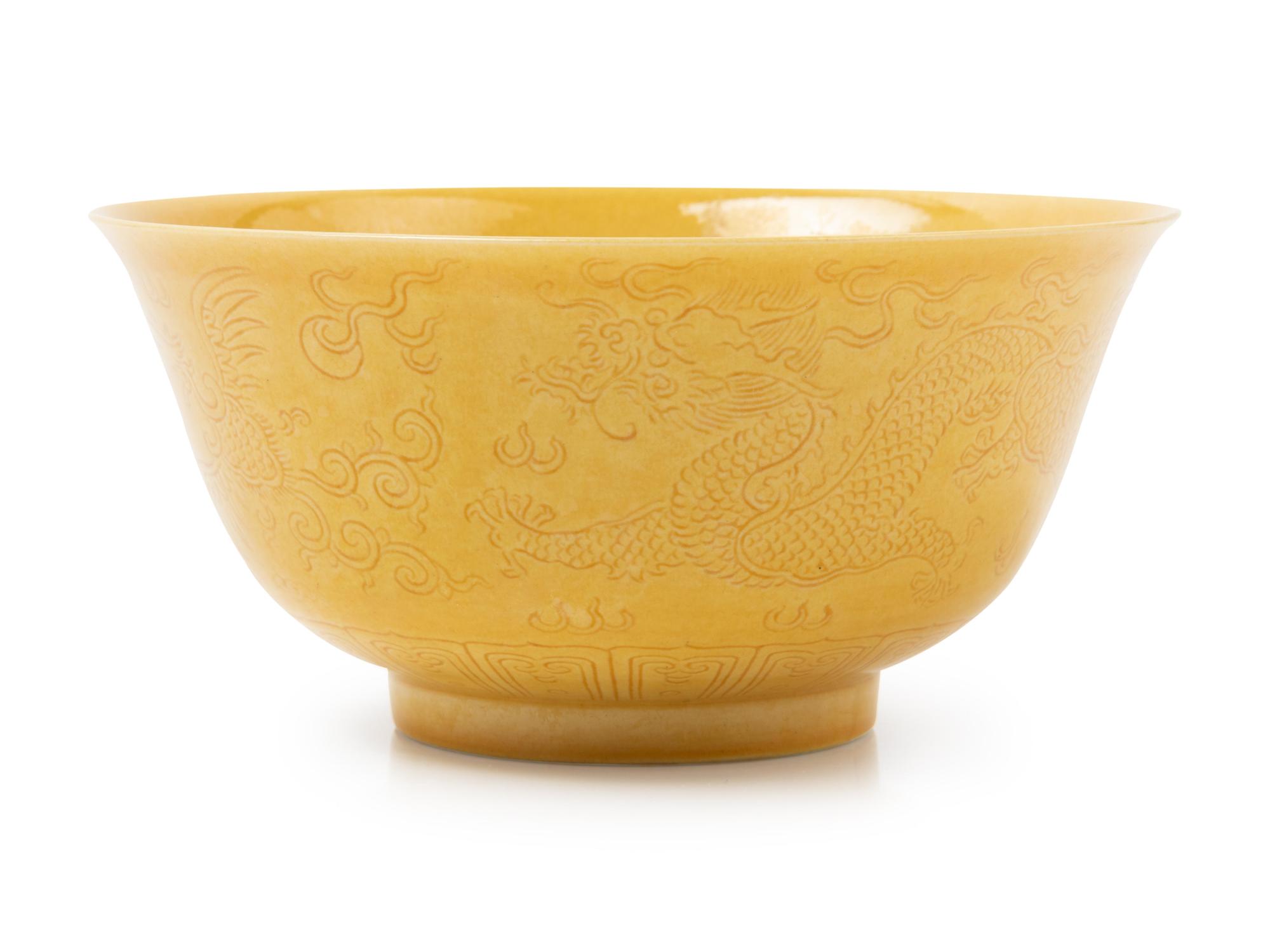 An Incised Yellow Glazed Porcelain 'Dragon and Phoenix' Bowl