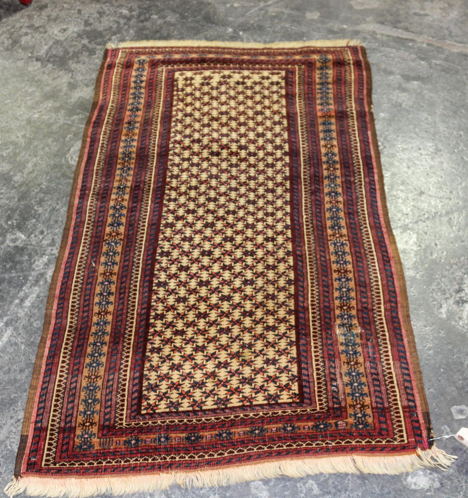 A Baluch Wool Rug 4 feet 7 inches x 2 feet 9 inches. — AFGHANISTAN, CIRCA 1930