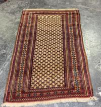 A Baluch Wool Rug 4 feet 7 inches x 2 feet 9 inches. — AFGHANISTAN, CIRCA 1930