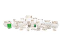 A Collection of Silver Mounted Glass Scent Bottles and Vanity Jars