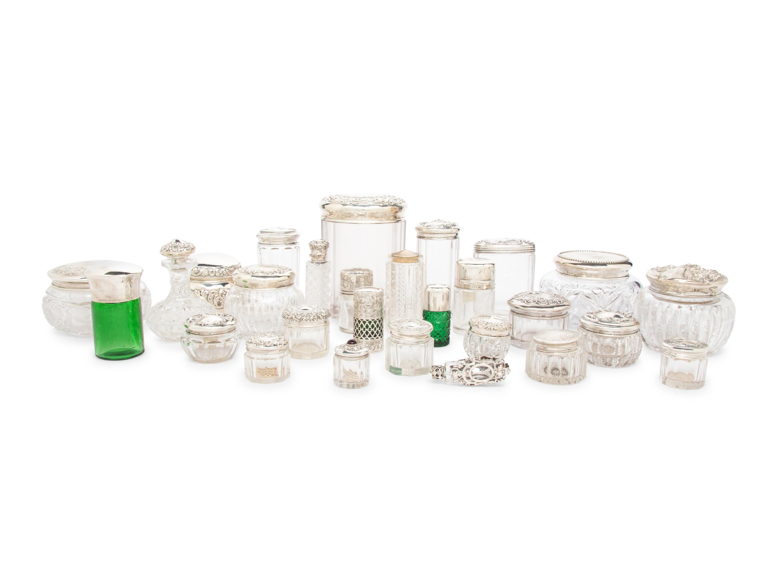 A Collection of Silver Mounted Glass Scent Bottles and Vanity Jars