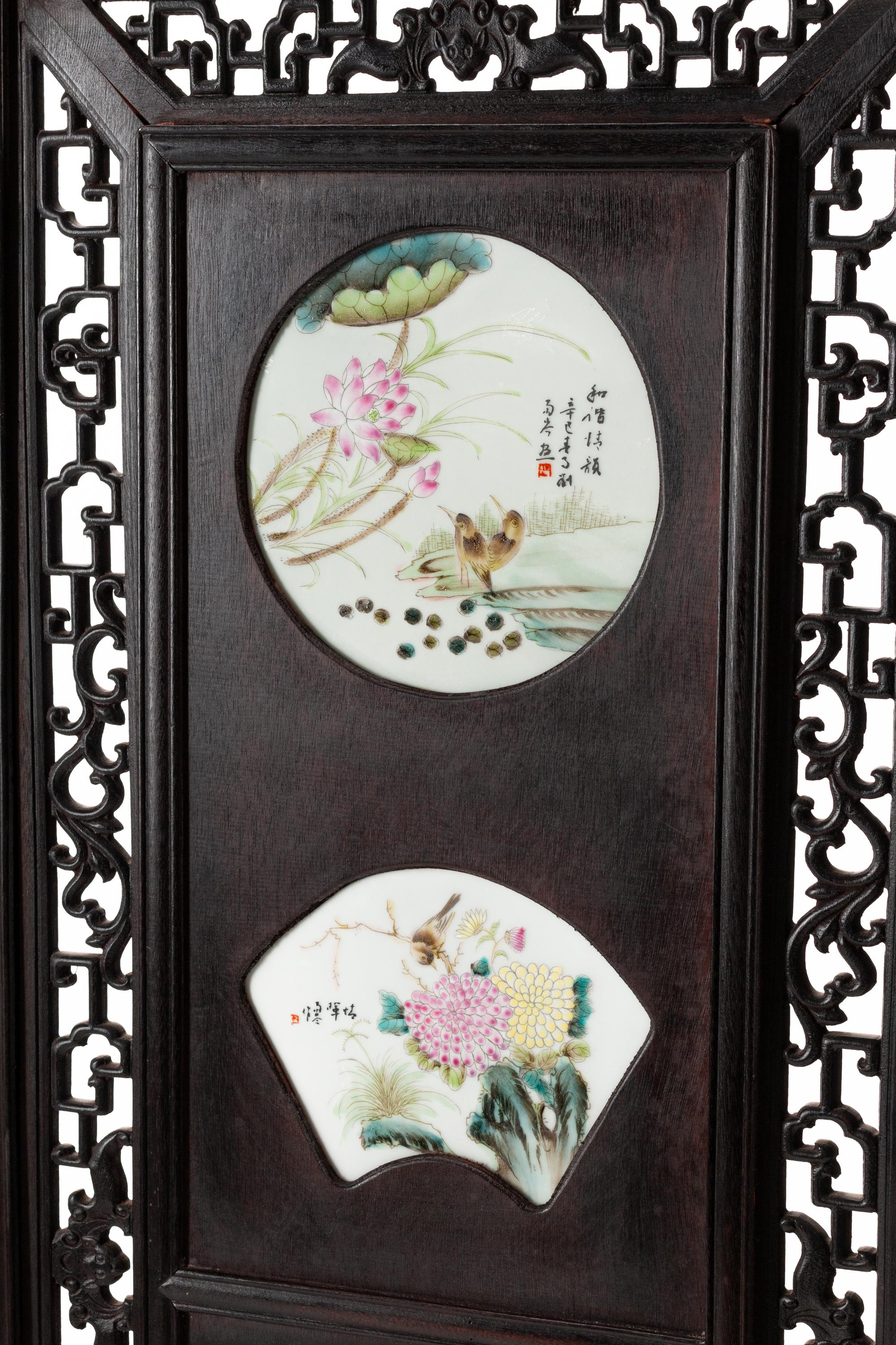 A Chinese Porcelain-Inset Pierce Carved Hardwood Floor Screen