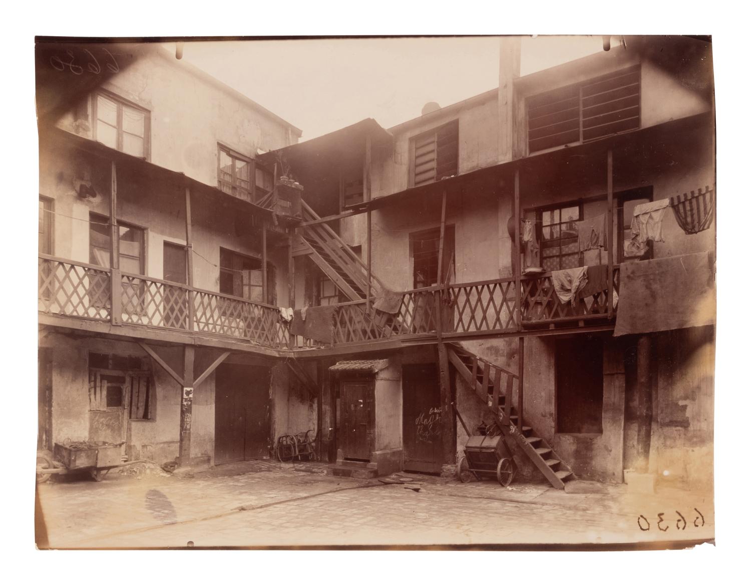 A group of four photographs depicting Paris ( Moulin Rouge [86 boulevard de Clichy] ; Passage Moret, ruelle des Gobelins ; Rue des Prêtres Saint-Séverin, au fond rue Boutebrie; Rue des Gobelins)