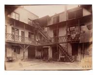 A group of four photographs depicting Paris ( Moulin Rouge [86 boulevard de Clichy] ; Passage Moret, ruelle des Gobelins ; Rue des Prêtres Saint-Séverin, au fond rue Boutebrie; Rue des Gobelins)