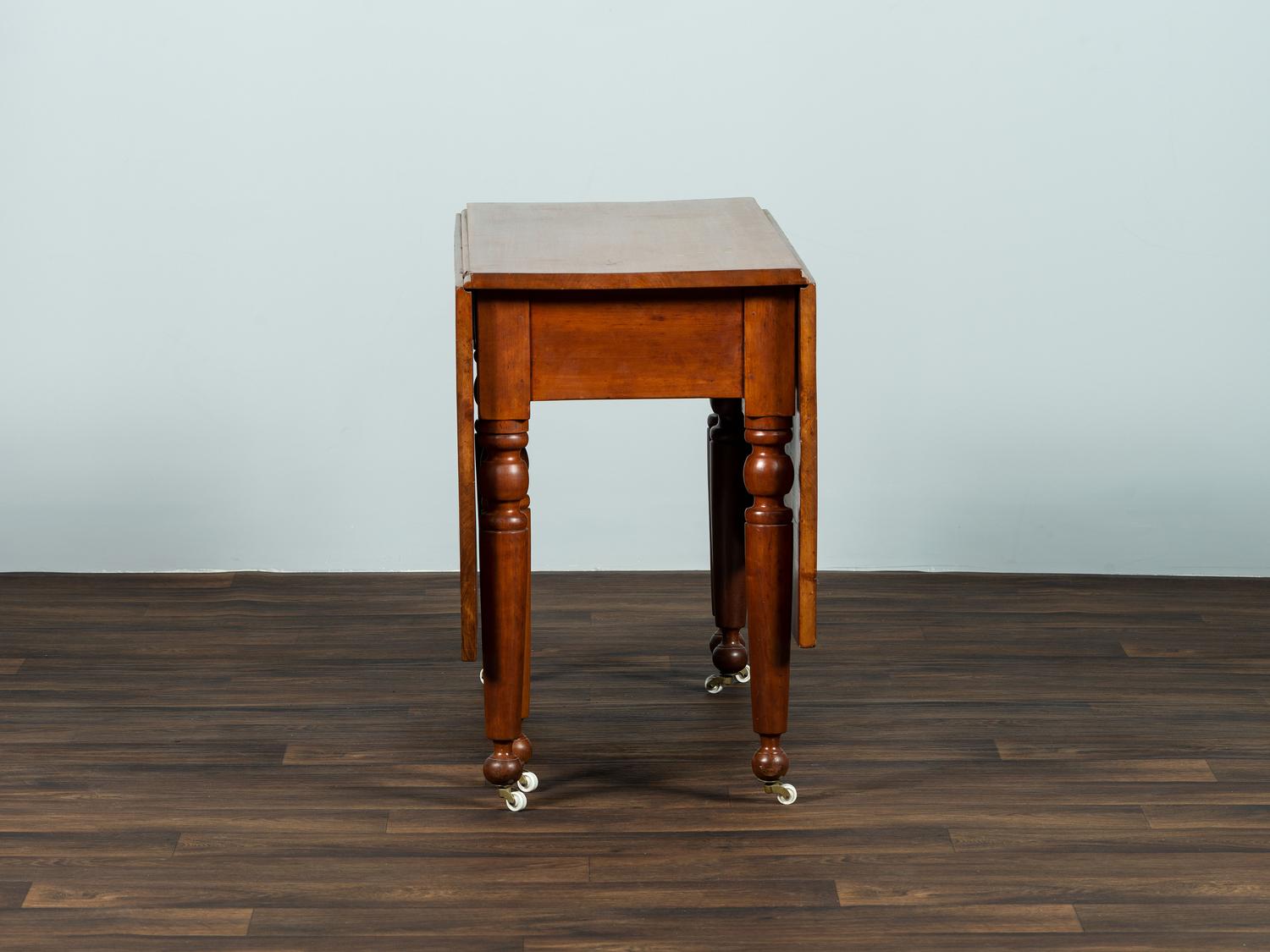 A Late Federal Cherrywood Drop-Leaf Dining Table (Please send consignor donation receipt once donated)