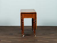 A Late Federal Cherrywood Drop-Leaf Dining Table (Please send consignor donation receipt once donated)