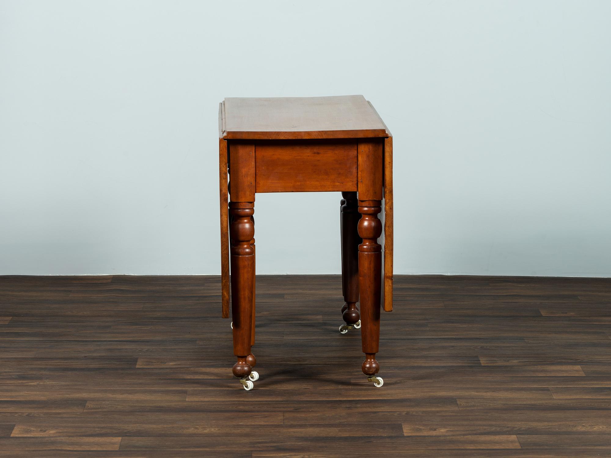 A Late Federal Cherrywood Drop-Leaf Dining Table (Please send consignor donation receipt once donated)
