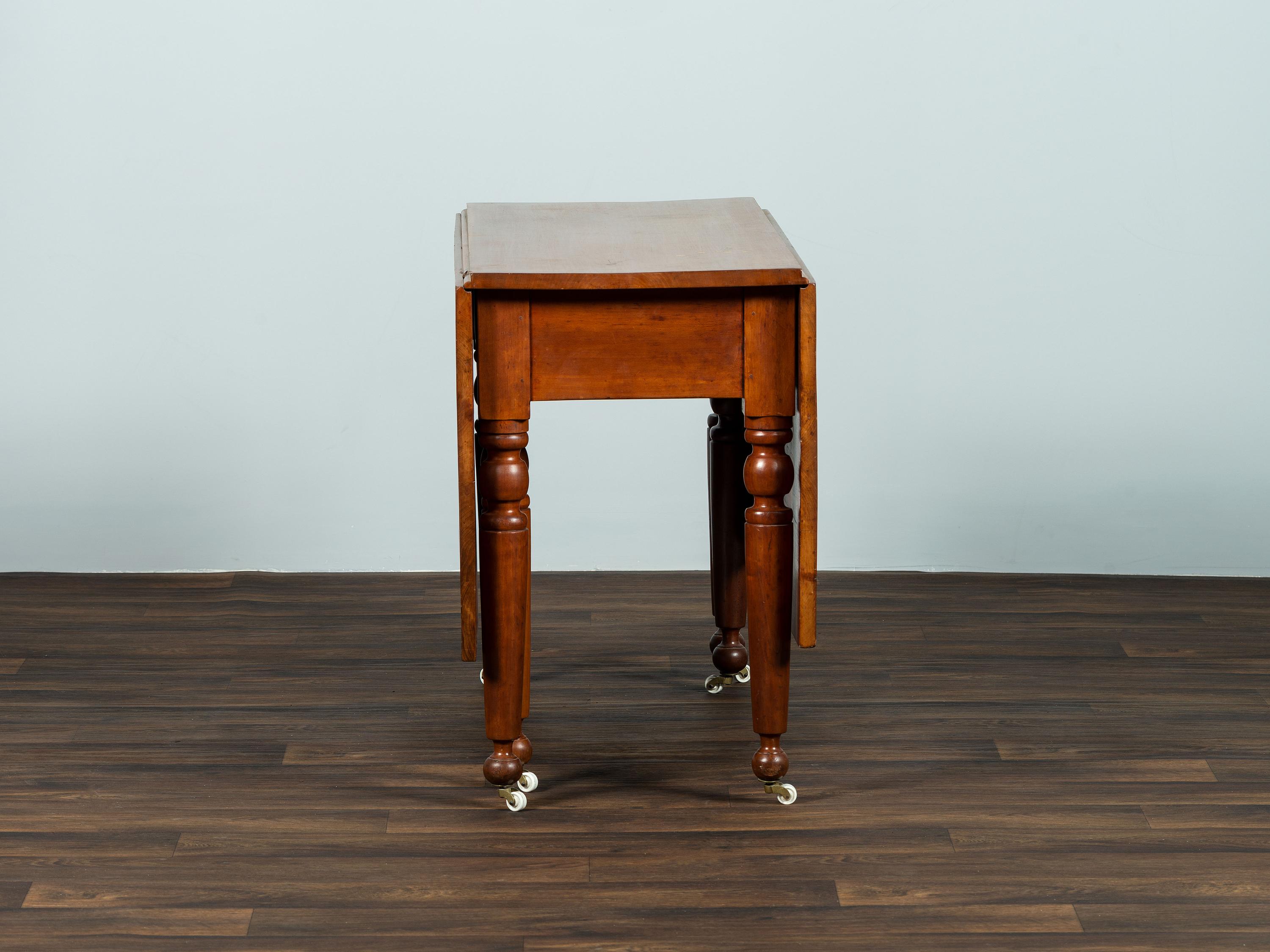 A Late Federal Cherrywood Drop-Leaf Dining Table (Please send consignor donation receipt once donated)