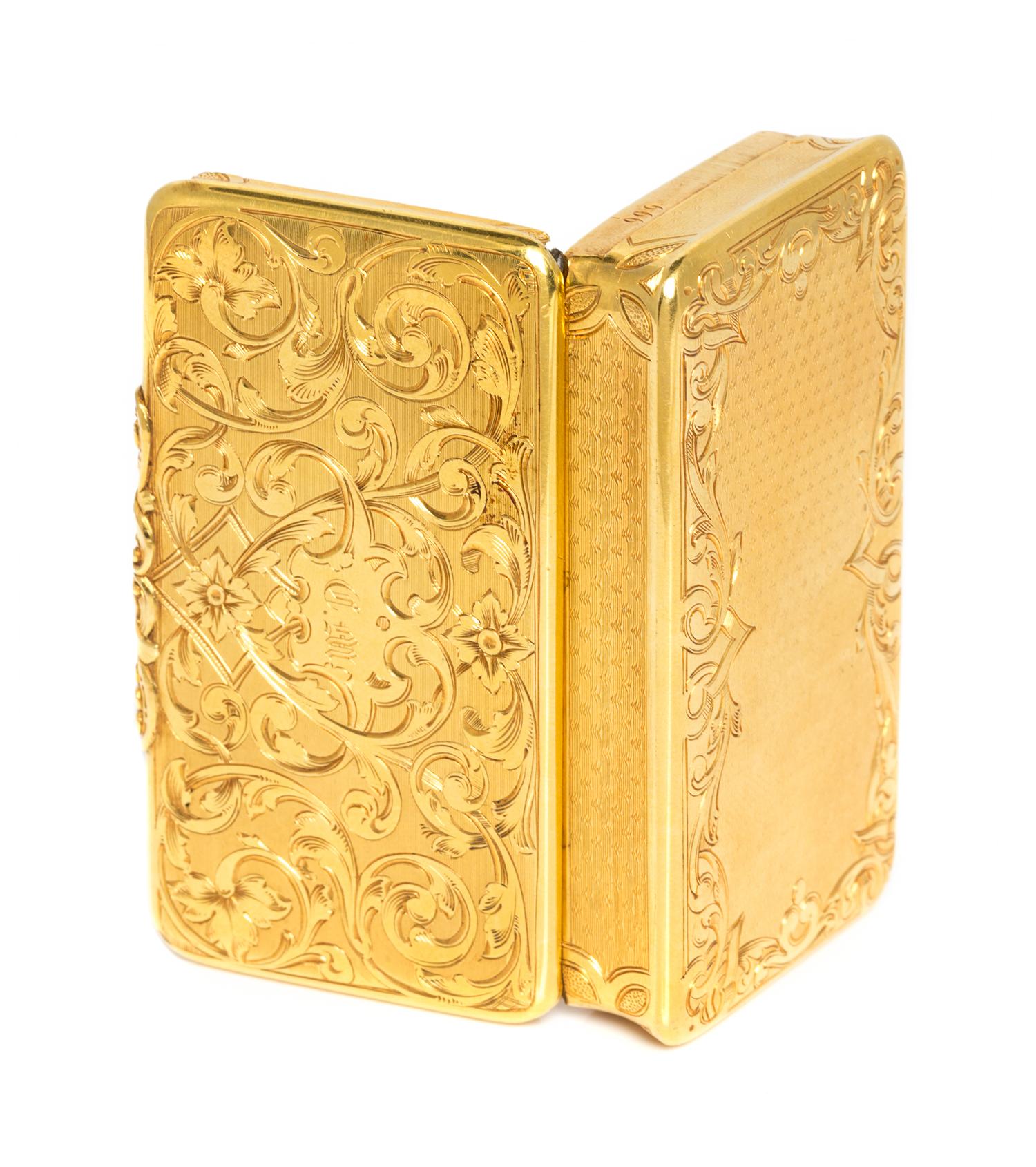 A French 18 Karat Gold Snuff Box, Possibly Louis Tassin, Paris, the lid worked with foliate volute and floral elements and centered by