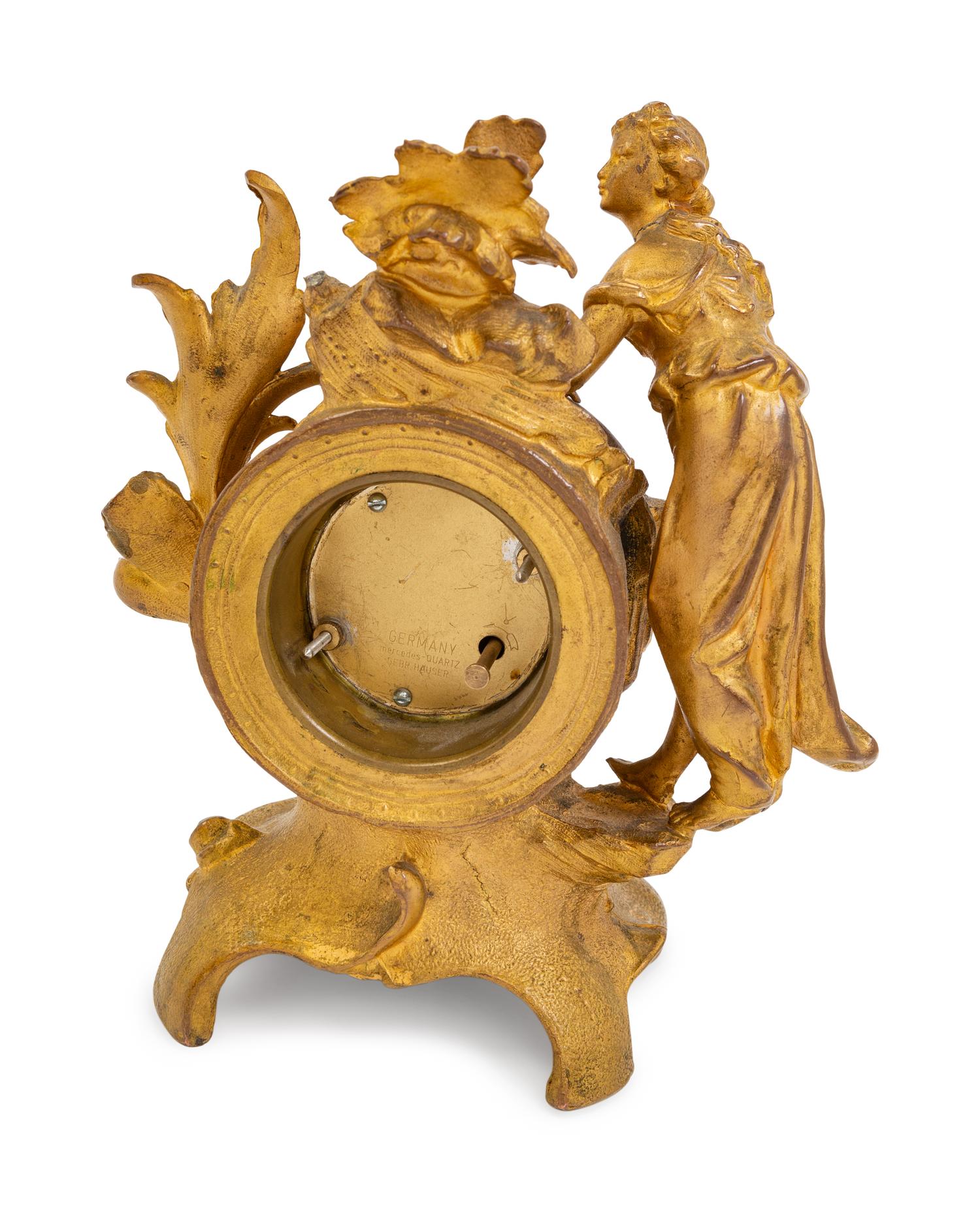 A Louis XV Style Gilt Metal Figural Clock with German Movement