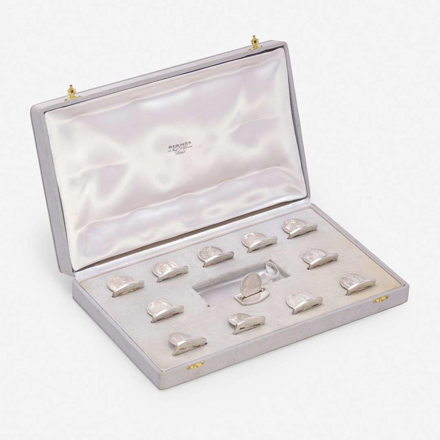 A Cased Set of Twelve French Silver Place Card Holders Ravinet Louis & Denfert Charles, retailed by Hermès, Paris, mid 20th century