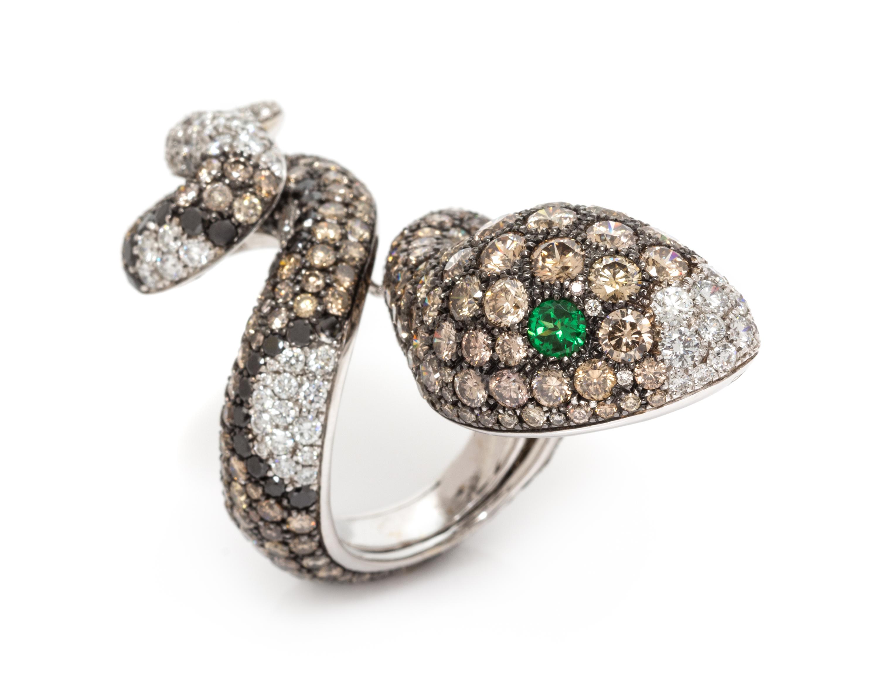 An 18 Karat White Gold, Diamond, Colored Diamond, Black Diamond and Tsavorite Garnet Snake Ring, 18.40 dwts.
