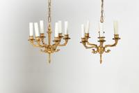 A Pair of Empire Gilt Bronze Six-Light Chandeliers