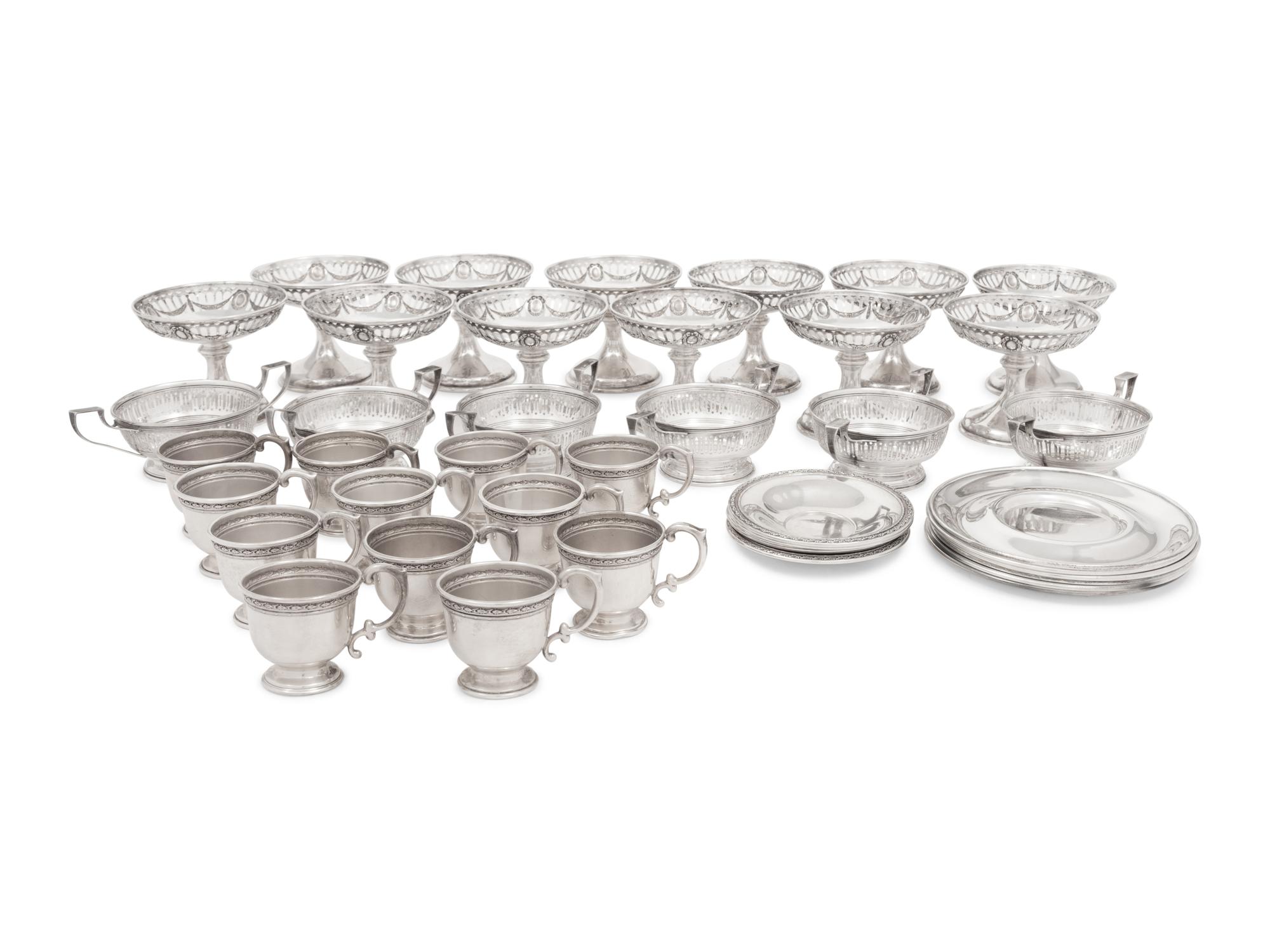 A Group of American Silver Cups and Saucers