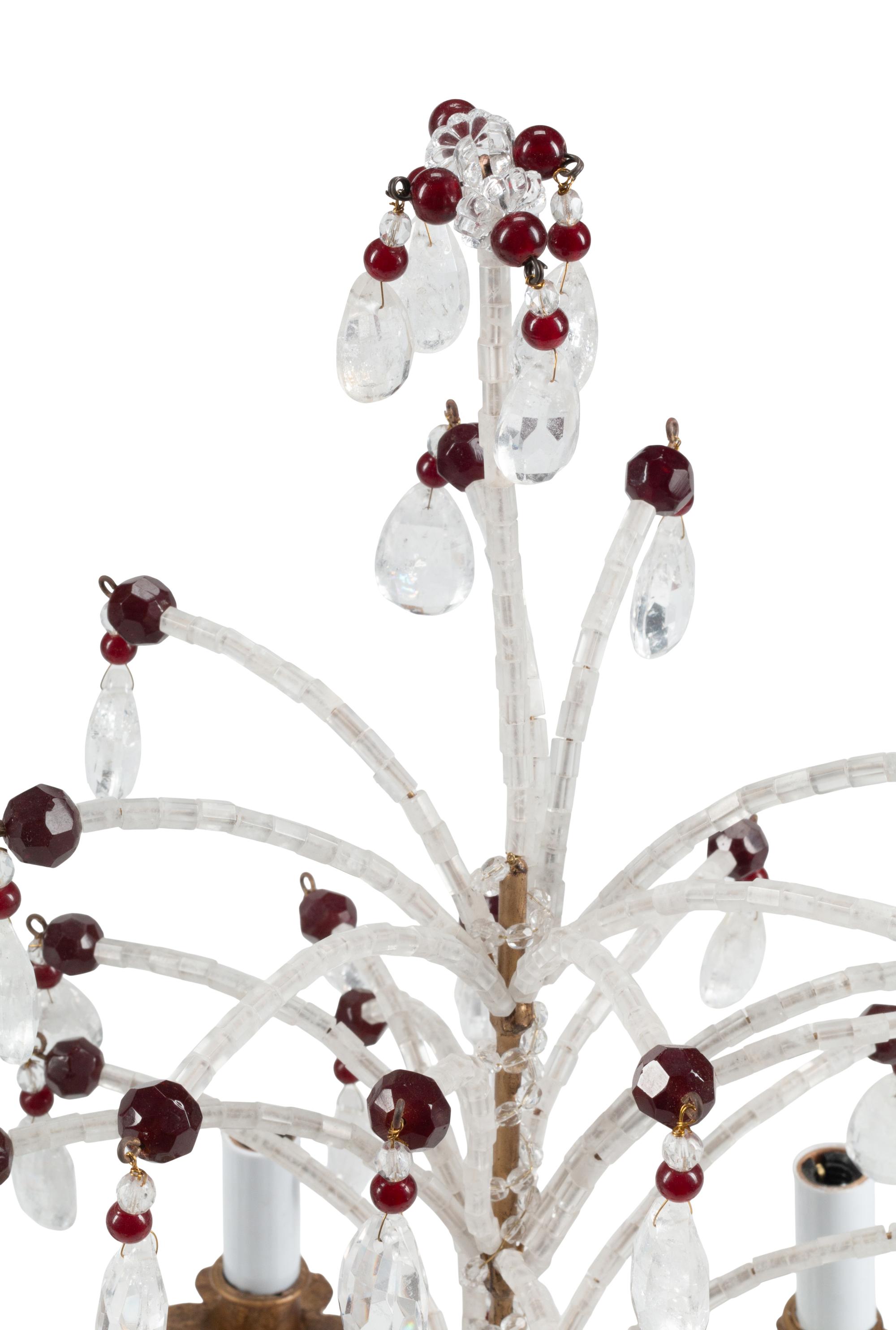 A Pair of Italian Carved and Rock Crystal Mounted Five-Light Candelabra