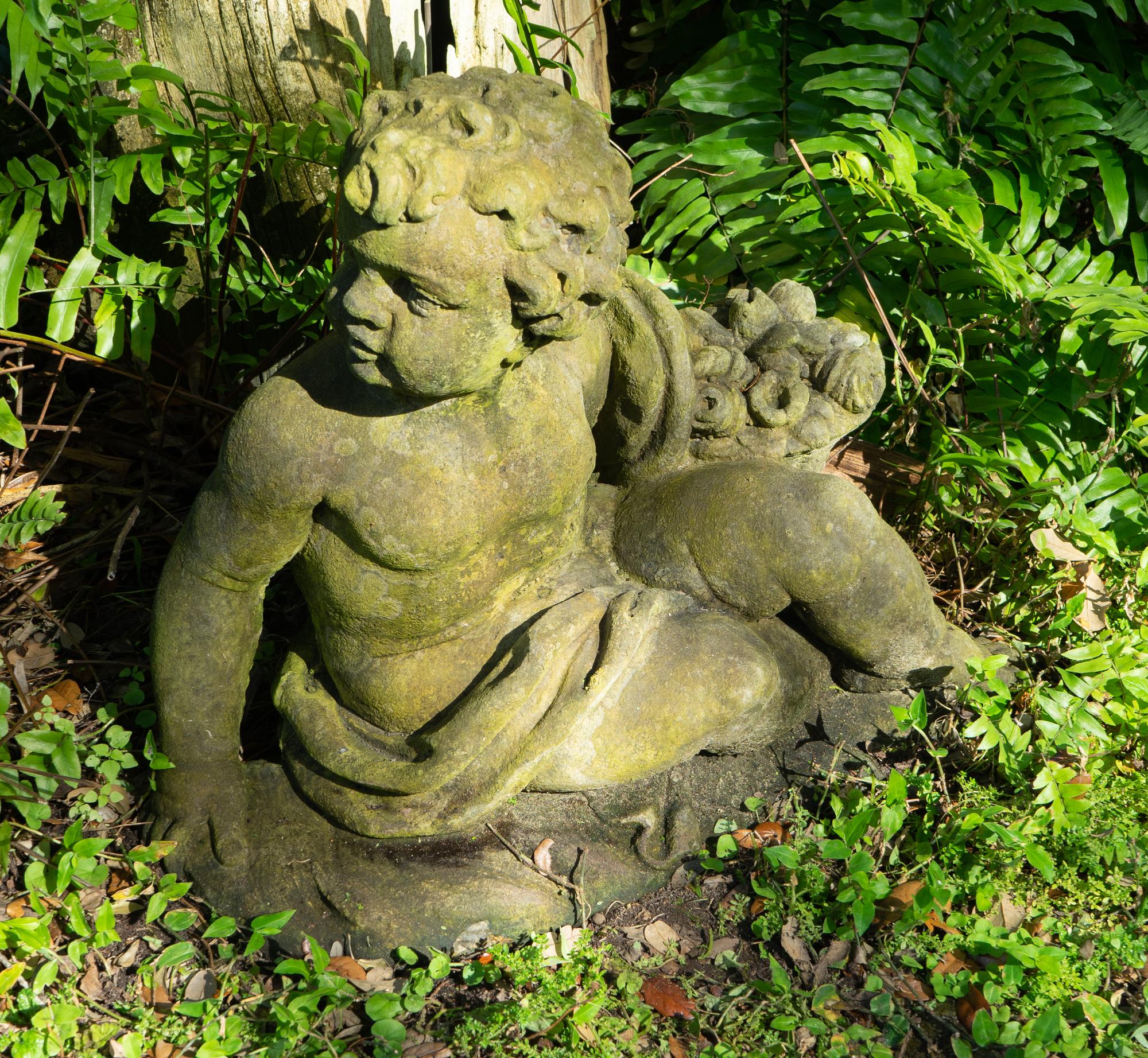 A Pair of Cast Stone Seated Putti