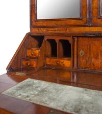 A George I Carved Burl Walnut Double-Dome Bureau Bookcase