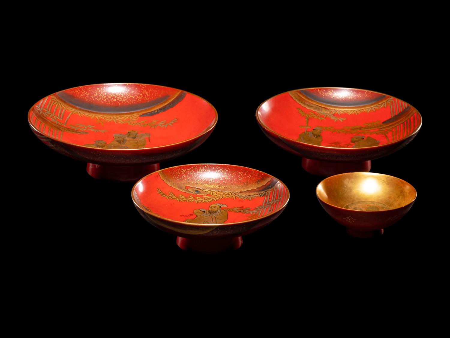 A Set of Three Japanese Gilt Decorated Red Lacquered Stem Dishes