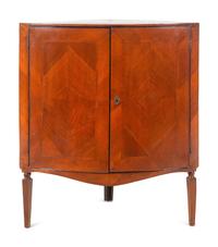A Continental Bookmatch Veneered Corner Cabinet