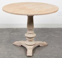 A Neoclassical Bleached Wood Center Table Height 28 3/4 x diameter 35 inches. — 20TH CENTURY