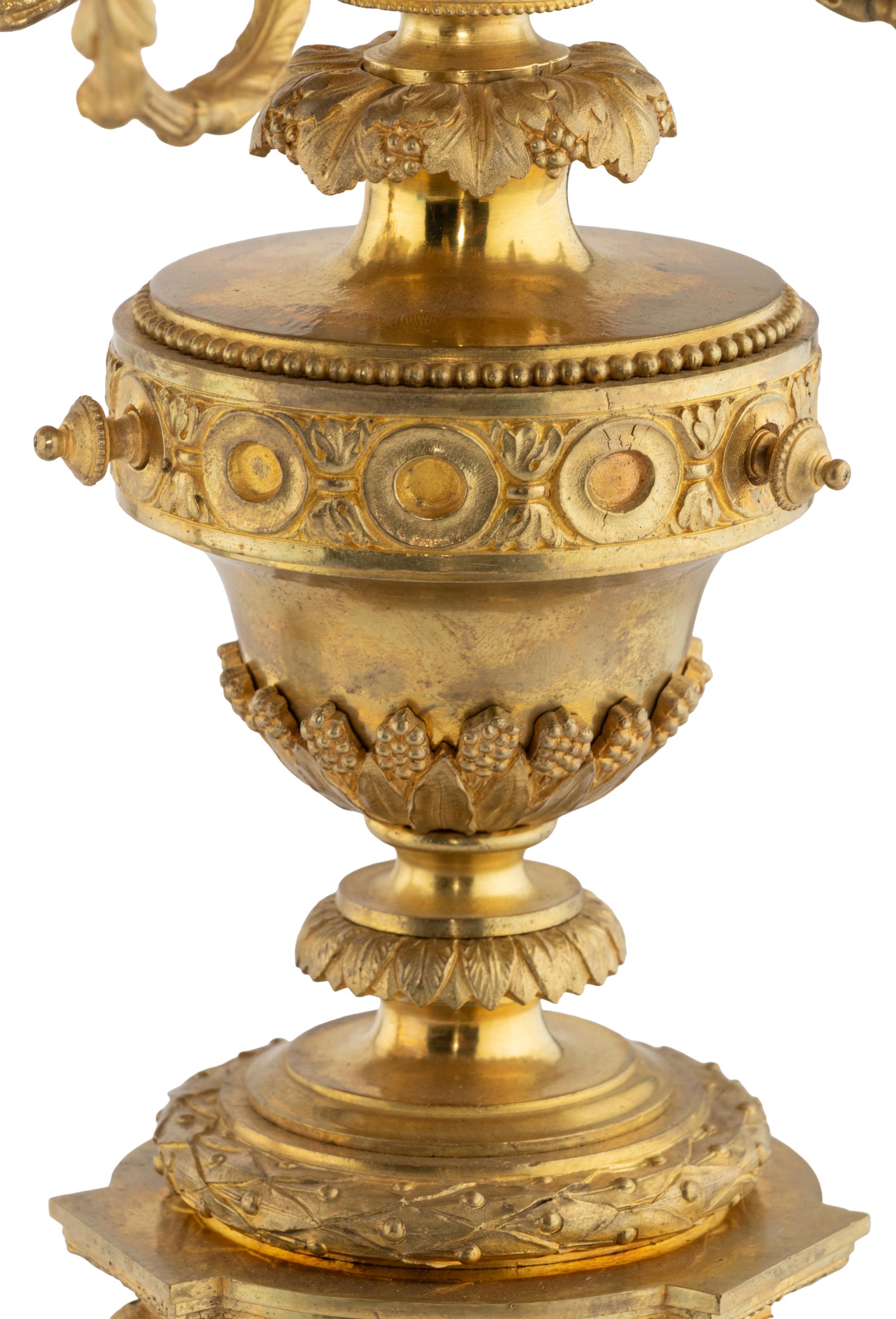 A Pair of Louis XVI Style Gilt Bronze and Marble Six-Light Candelabra