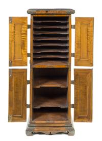 A Japanese Tsuba Inset Zelkova Wood Cabinet Height 51 1/2 x width 20 x depth 16 1/2 inches. — TSUBA: 19TH CENTURY; CABINET: LATE 19TH/EARLY 20TH CENTURY