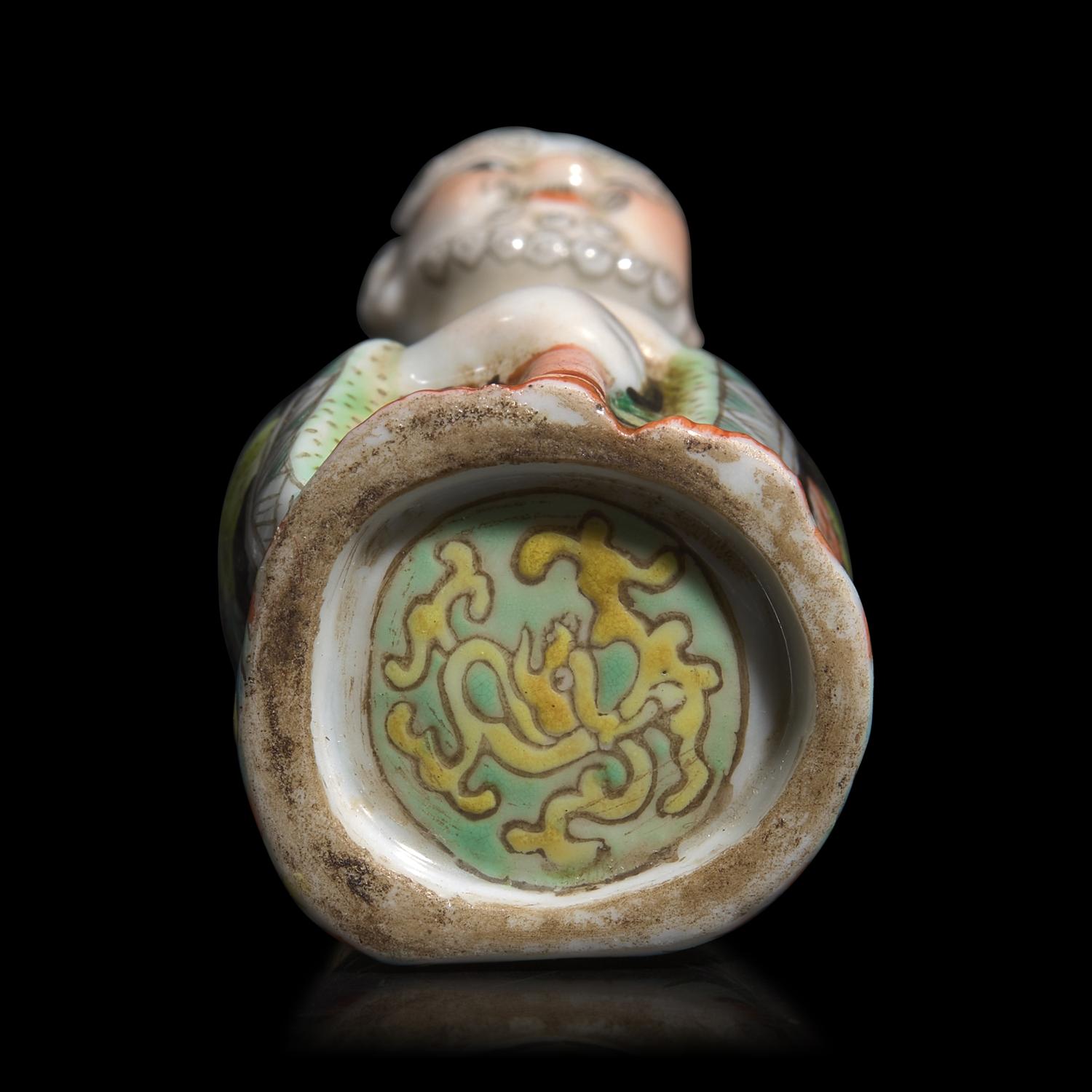 A Chinese Enameled Molded Porcelain Figural Snuff Bottle, Late 19th century
