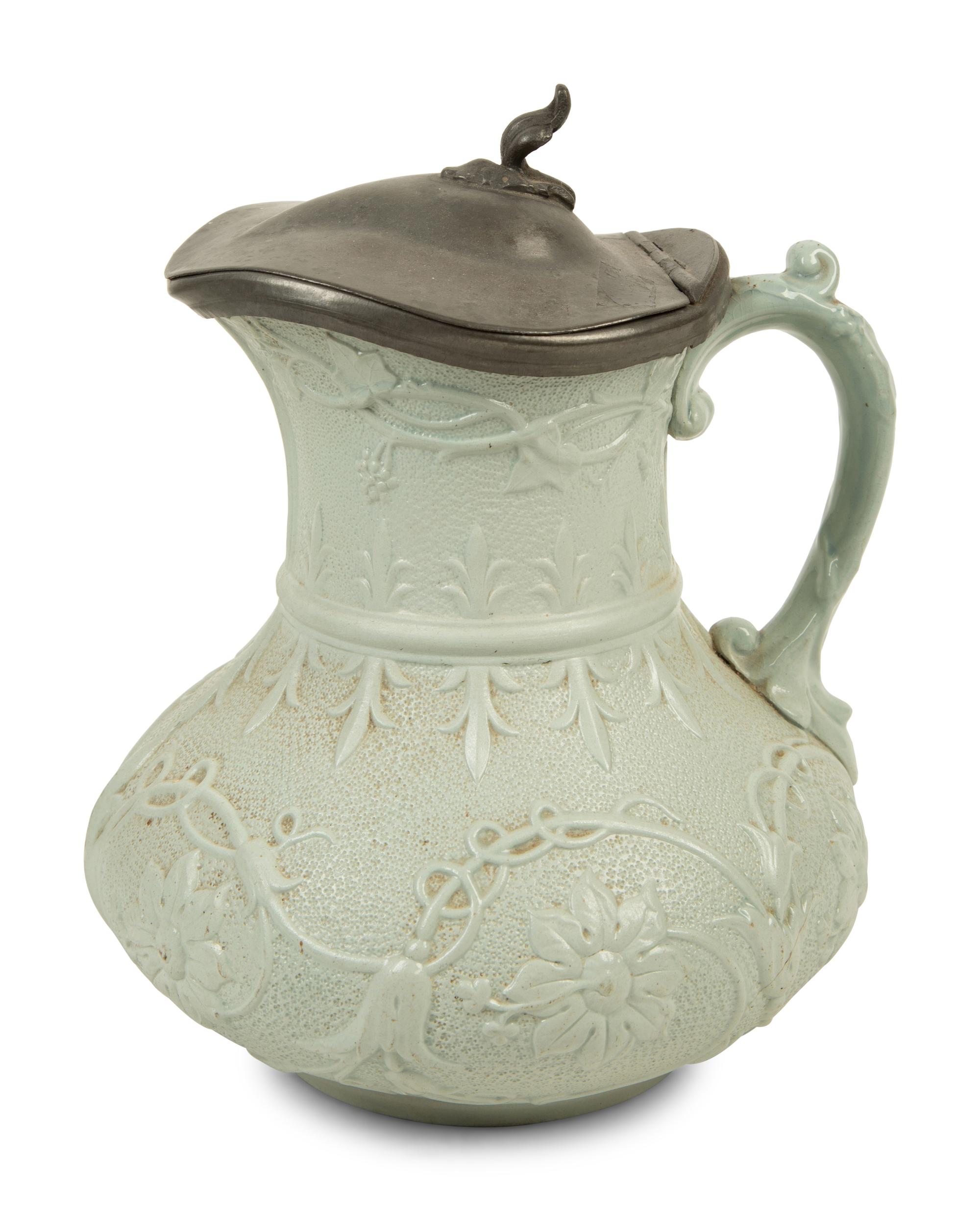 A Collection of Eight English Salt Glazed Relief Form Pitchers and Molded Earthenware — 19TH CENTURY