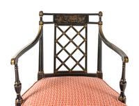 A Pair of George III Black Painted and Parcel-Gilt Armchairs