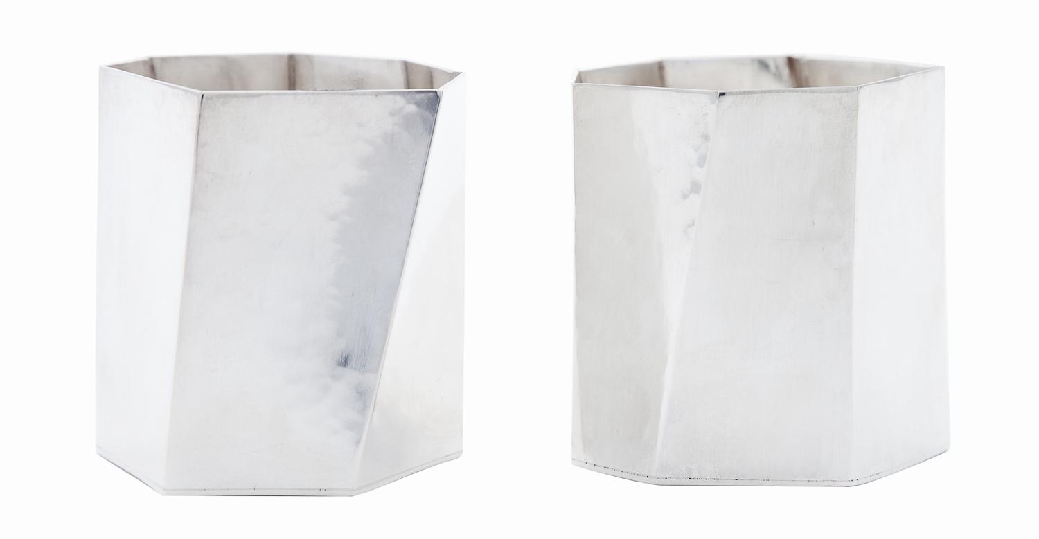 A Pair of Danish Modernist Silver Cups, Rey Urban for Age Fausing, Copenhagen, each of heptagonal form with irregular paneled sides.