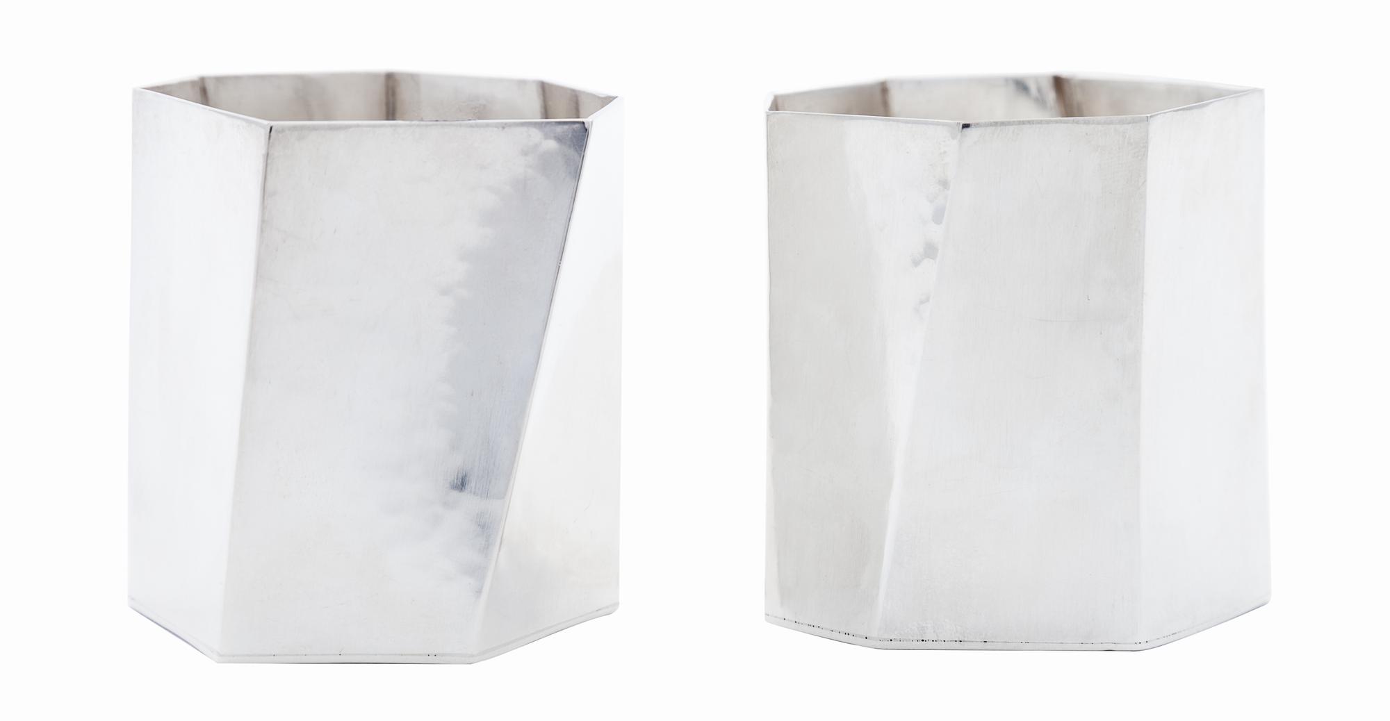 A Pair of Danish Modernist Silver Cups, Rey Urban for Age Fausing, Copenhagen, each of heptagonal form with irregular paneled sides.