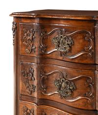 A Louis XV Walnut Serpentine Front Commode