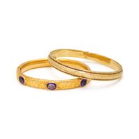 COLLECTION OF YELLOW GOLD BANGLE BRACELETS
