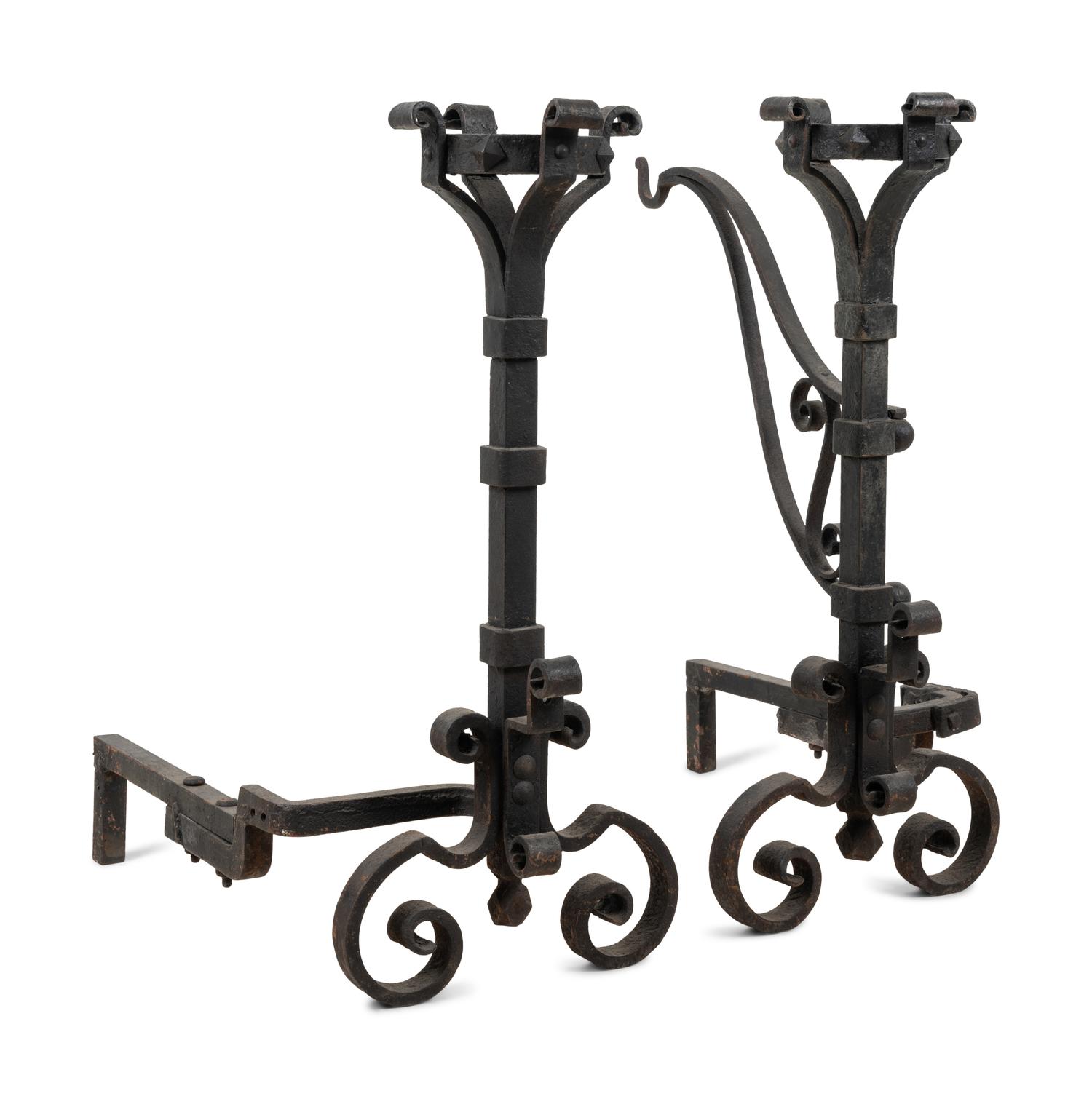 A Pair of Continental Iron Andirons with Posset Cup Holders