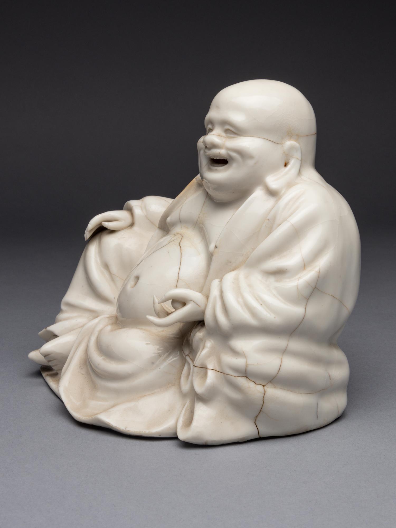A Blanc-de-Chine Porcelain Figure of Budhai Buddha