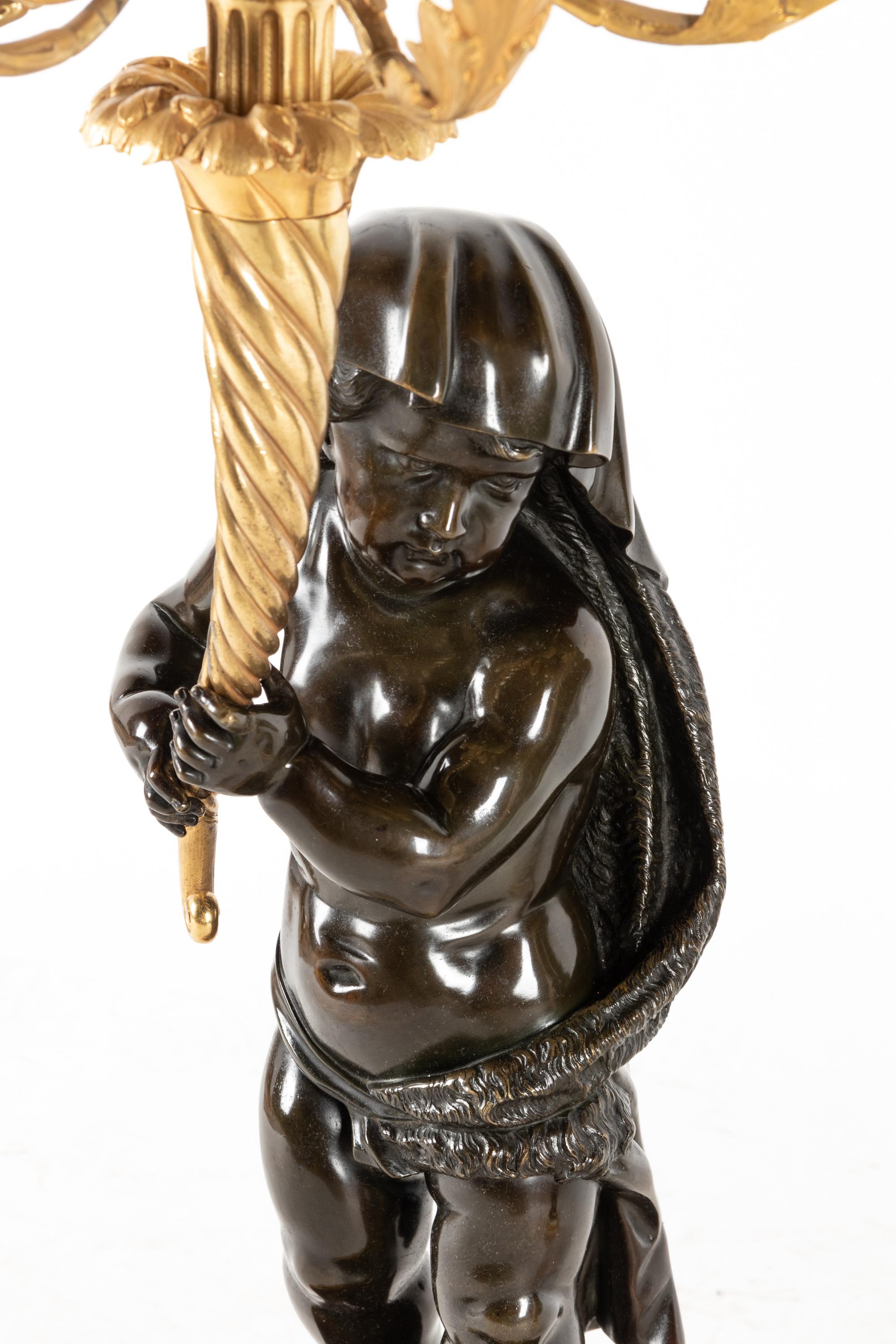 A Fine Pair of Large Louis XVI Style Marble and Parcel Gilt Bronze Figural Seven-Light Candelabra