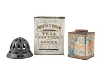 A Cast Iron String Holder and Two Advertising Tins