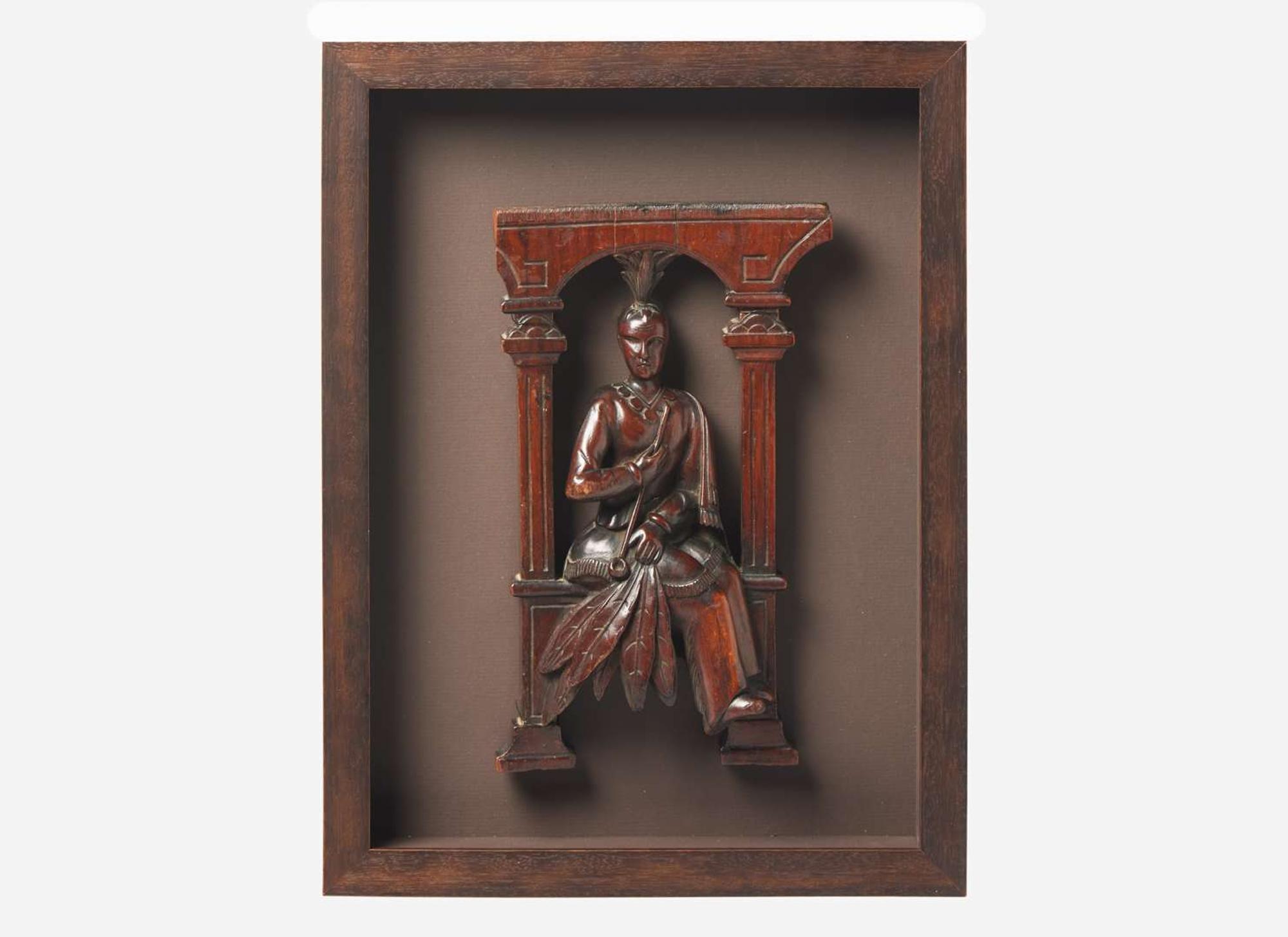 A carved architectural element of an American Indian with a Pipe, South Carolina, 19th century
