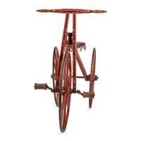 A Carved and Painted Wood Boneshaker Child’s Bicycle