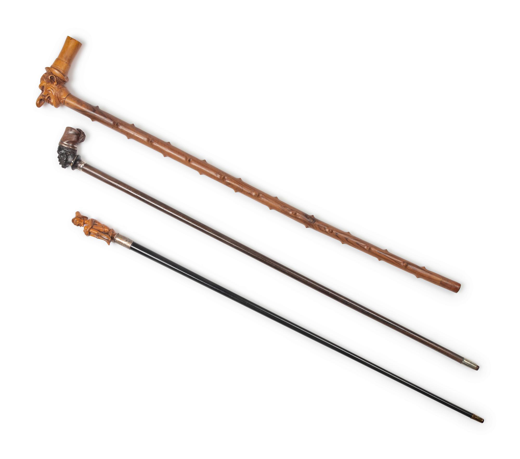 Three Continental Carved Wood Figural Canes