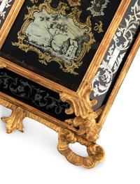 A German Rococo Carved Giltwood and Églomisé Decorated Barometer